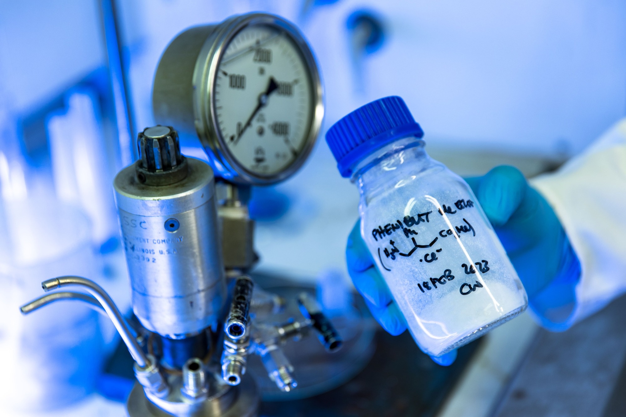 Hand holding a glass bottle