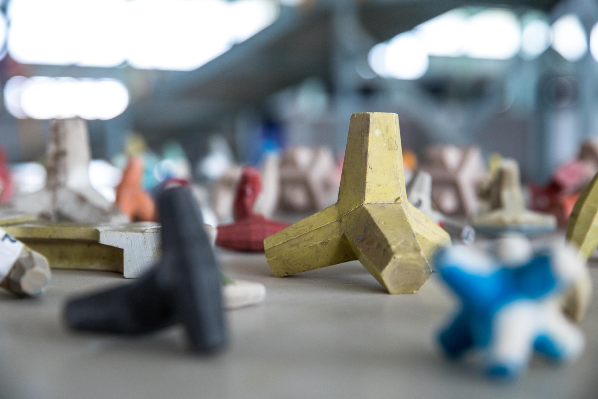 Hand holding a container with yellowish liquid