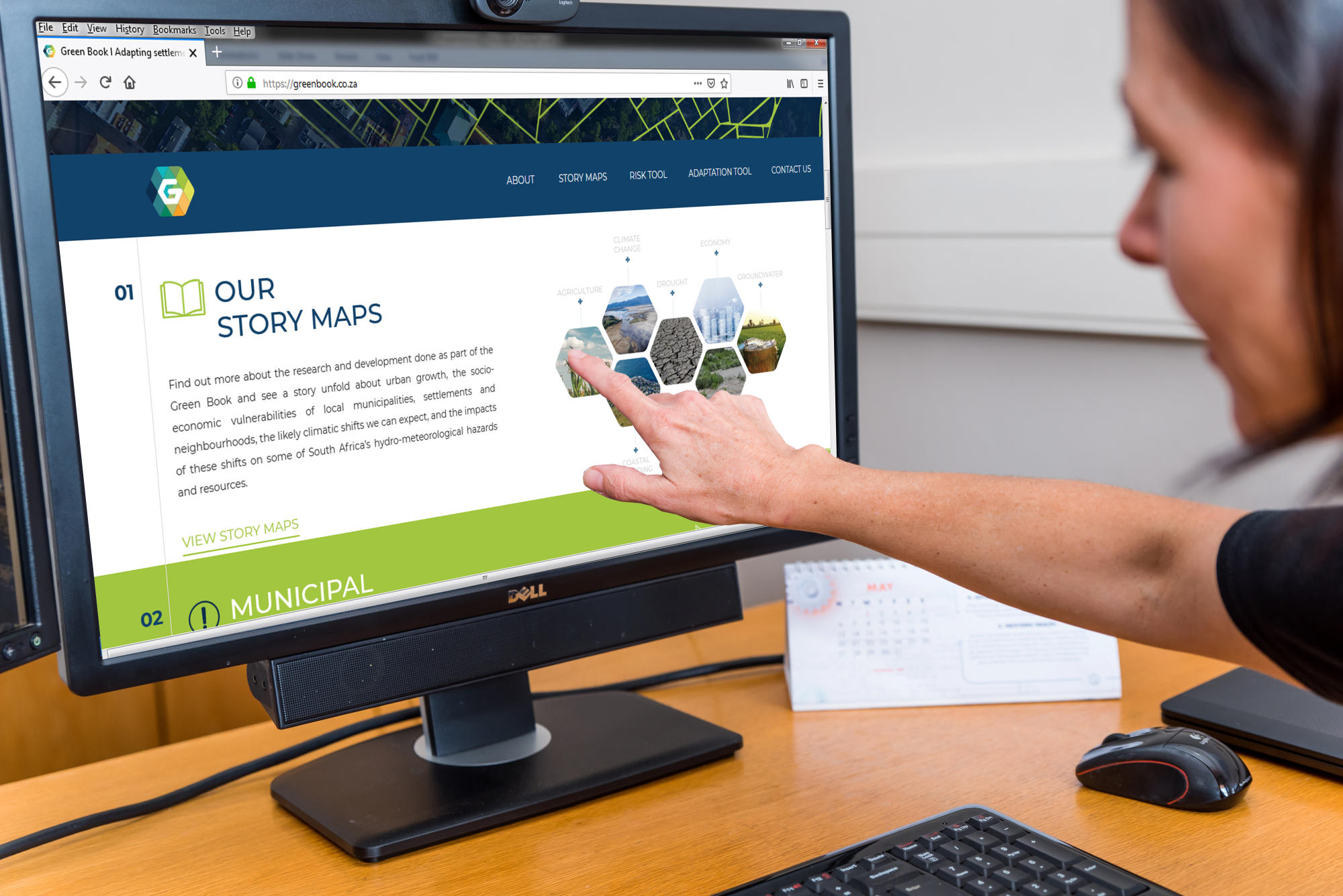 Hand holding a container with yellowish liquid