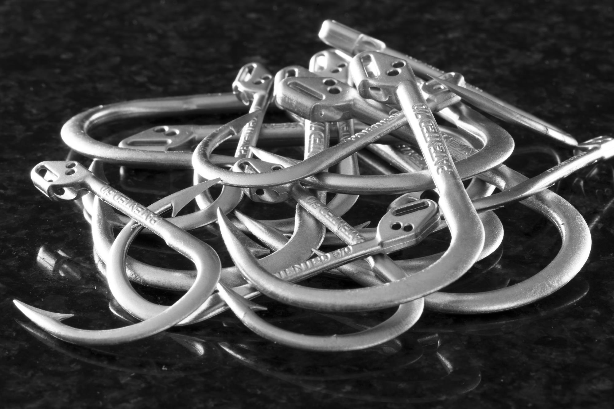 Hand holding a container with yellowish liquid