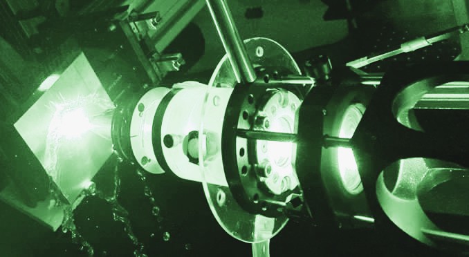 Hand holding a container with yellowish liquid