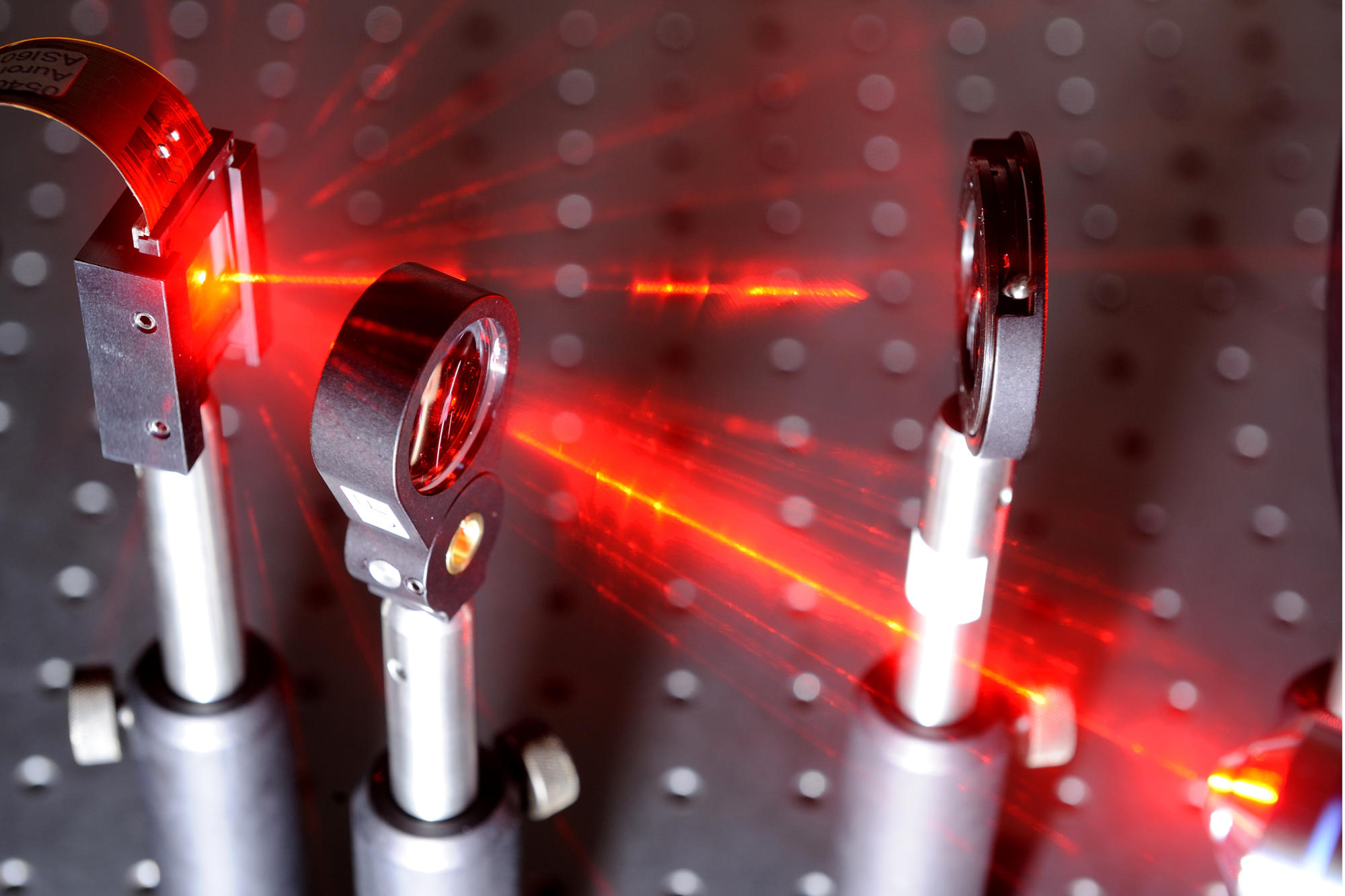 Hand holding a container with yellowish liquid