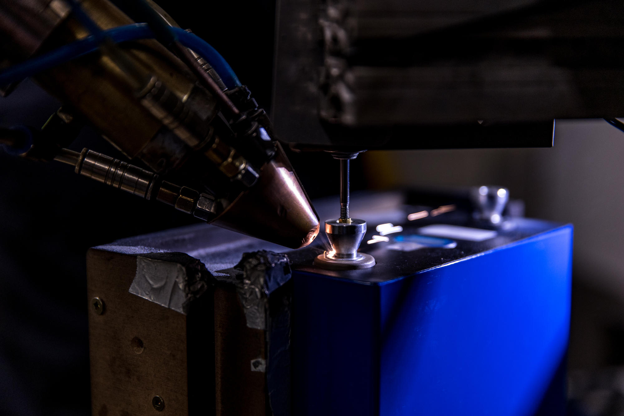 Hand holding a container with yellowish liquid