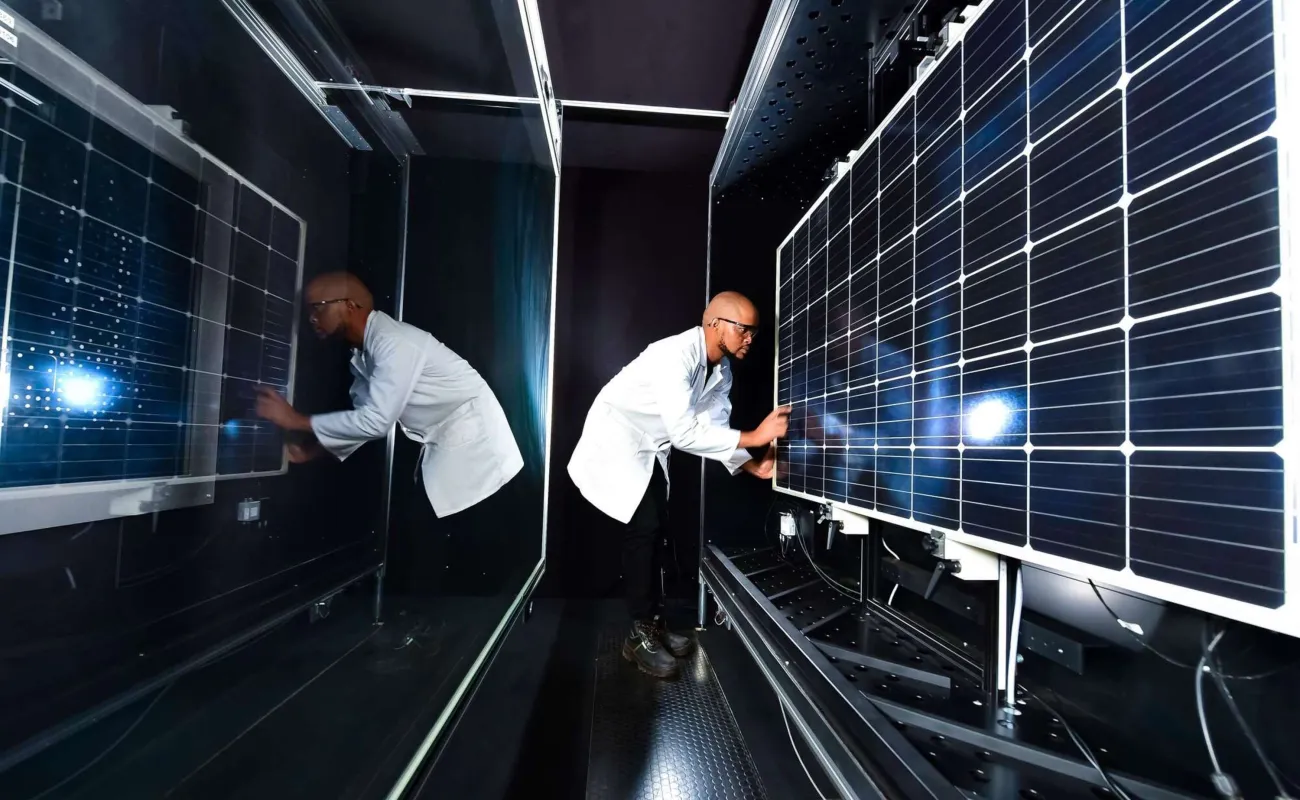 Hand holding a container with yellowish liquid