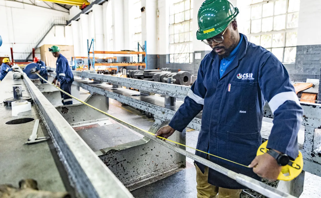 Technician measuring an item