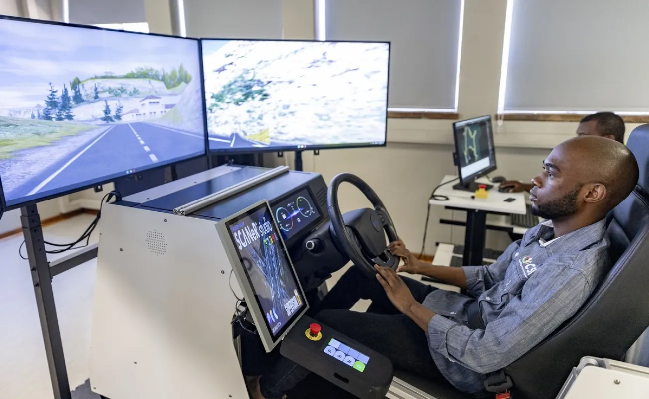 Person in front of computer screens