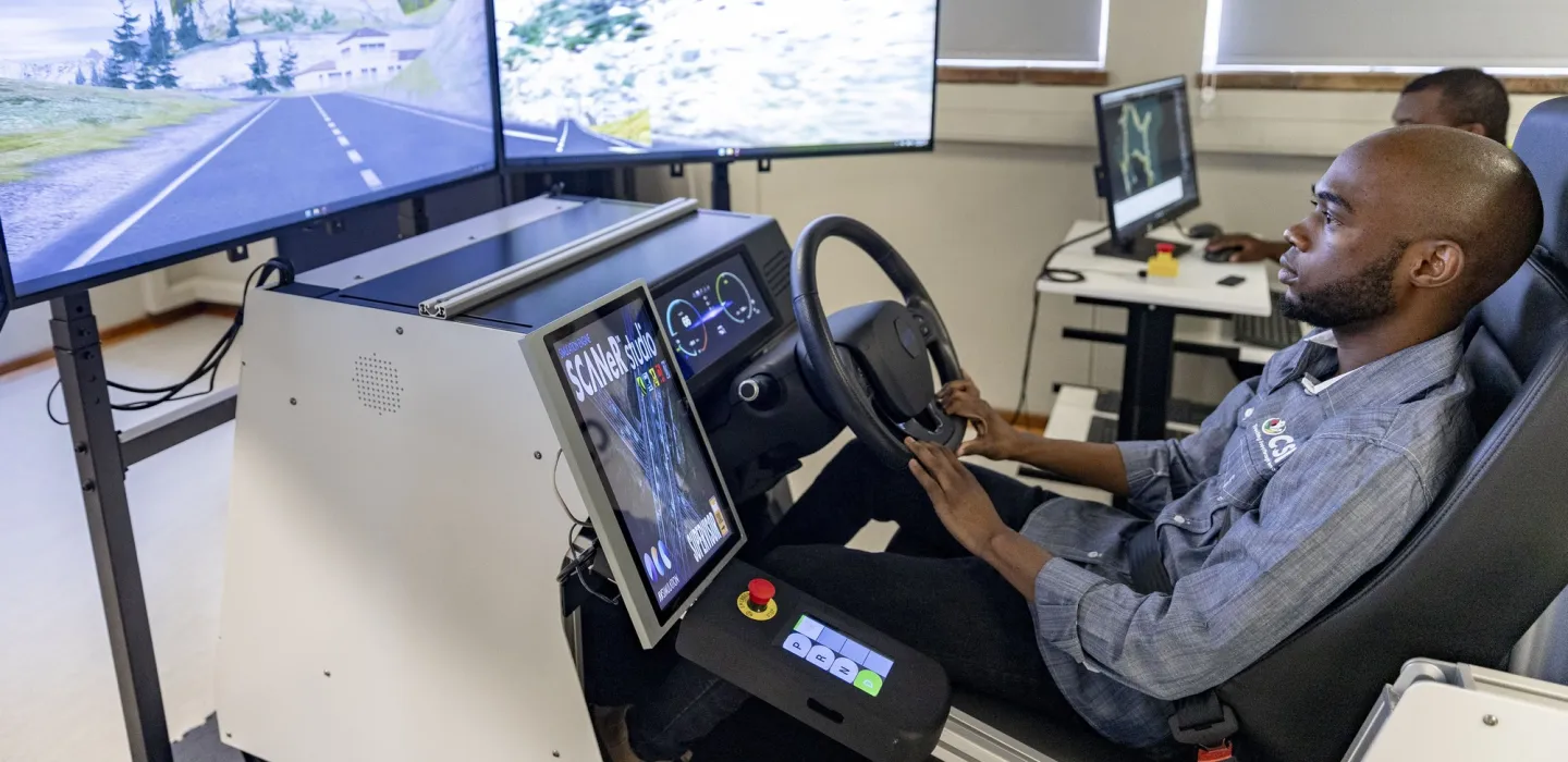 Man looking at computer screens