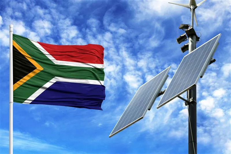 Solar panel and South African flag next to it