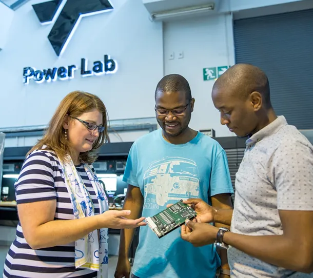 Three people conversing