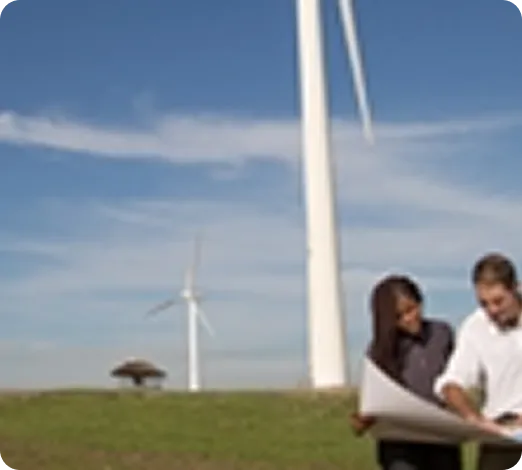Two people looking at large document